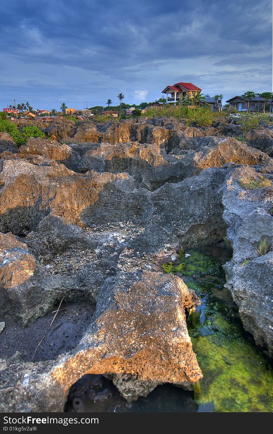 This rocky terrain is located in Barangay Babag, Lapu-lapu City, Cebu, Philippines. This HDR was taken during sunset.