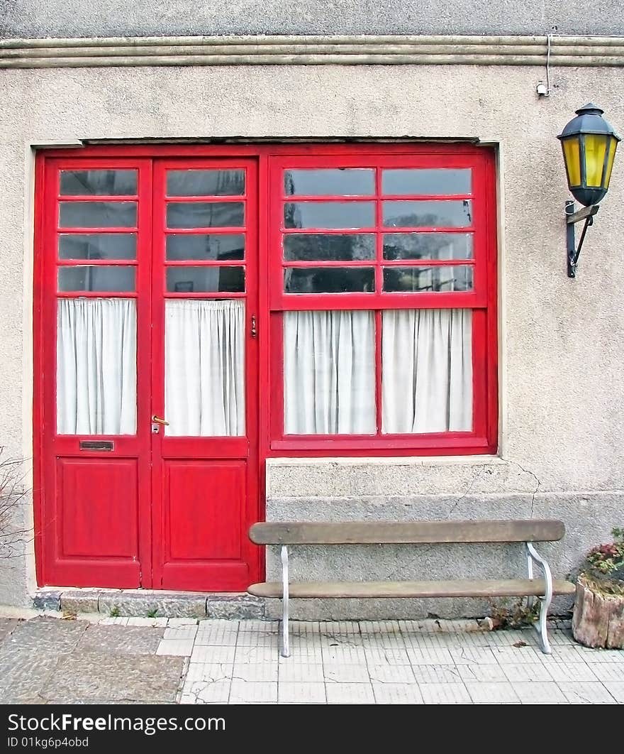 Beautiful and old red house door. Classic construction. Beautiful and old red house door. Classic construction.