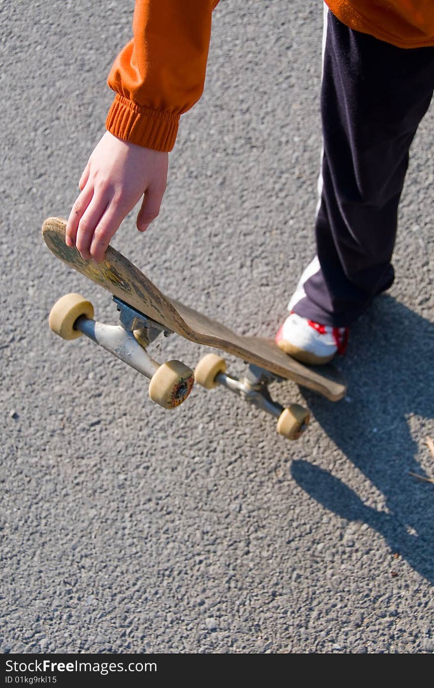 A young teen skateboarding and having fun in a suburban setting. A young teen skateboarding and having fun in a suburban setting.