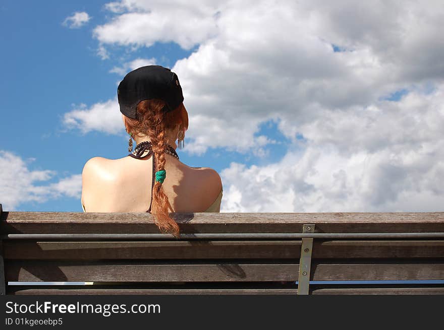 Girl, Bench And Clouds