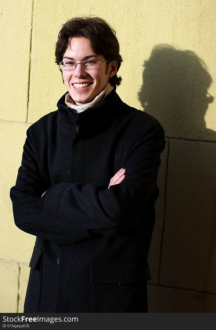 Pretty smiling young man outdoor. Pretty smiling young man outdoor