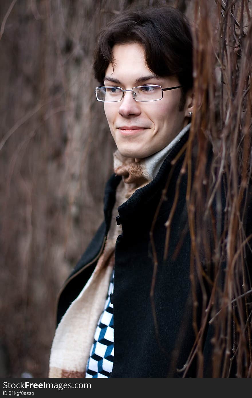 Pretty smiling young man outdoor. Pretty smiling young man outdoor