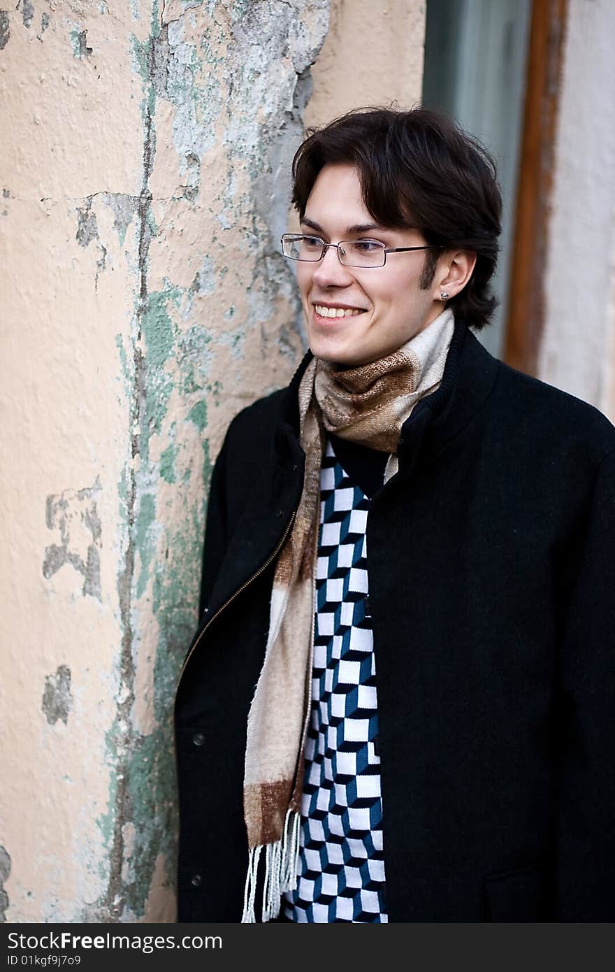 Pretty smiling young man outdoor. Pretty smiling young man outdoor