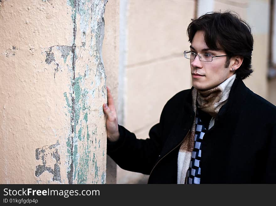 Pretty young man against a stone wall. Pretty young man against a stone wall