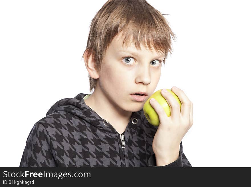 Isolated boy eating apple over white background. Isolated boy eating apple over white background