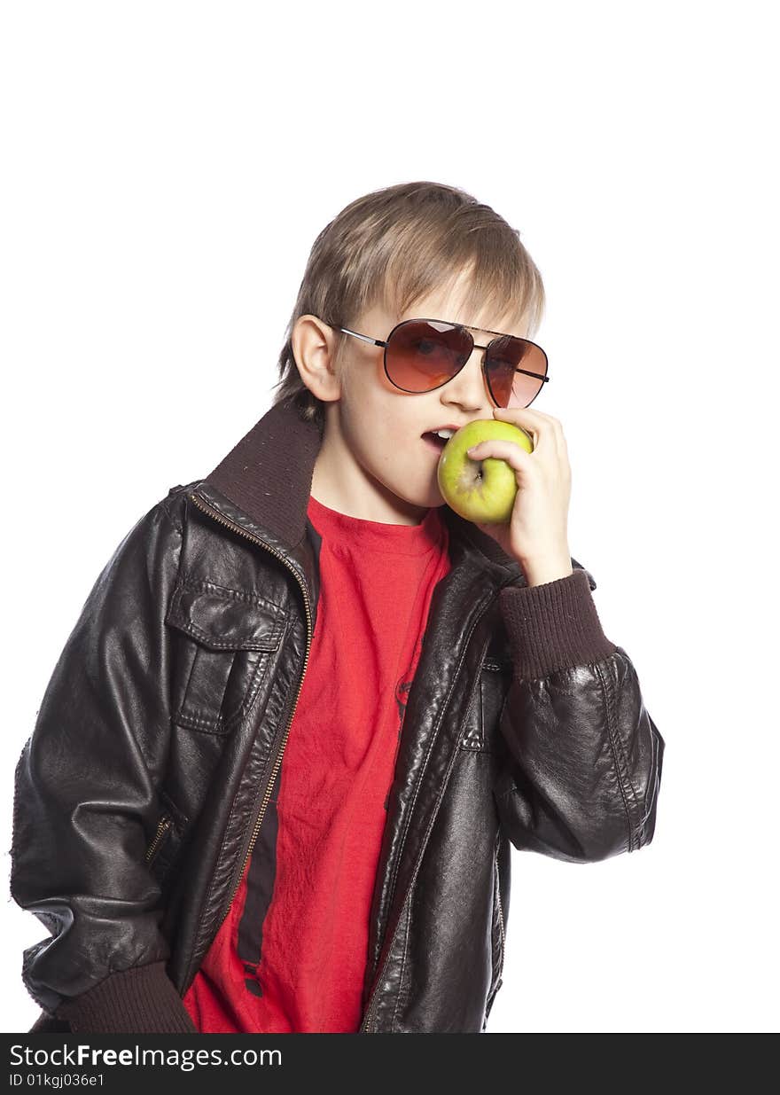 Isolated boy eating apple over white background. Isolated boy eating apple over white background