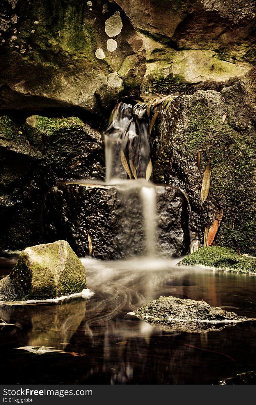 The little waterfall in deep spring forest. The little waterfall in deep spring forest