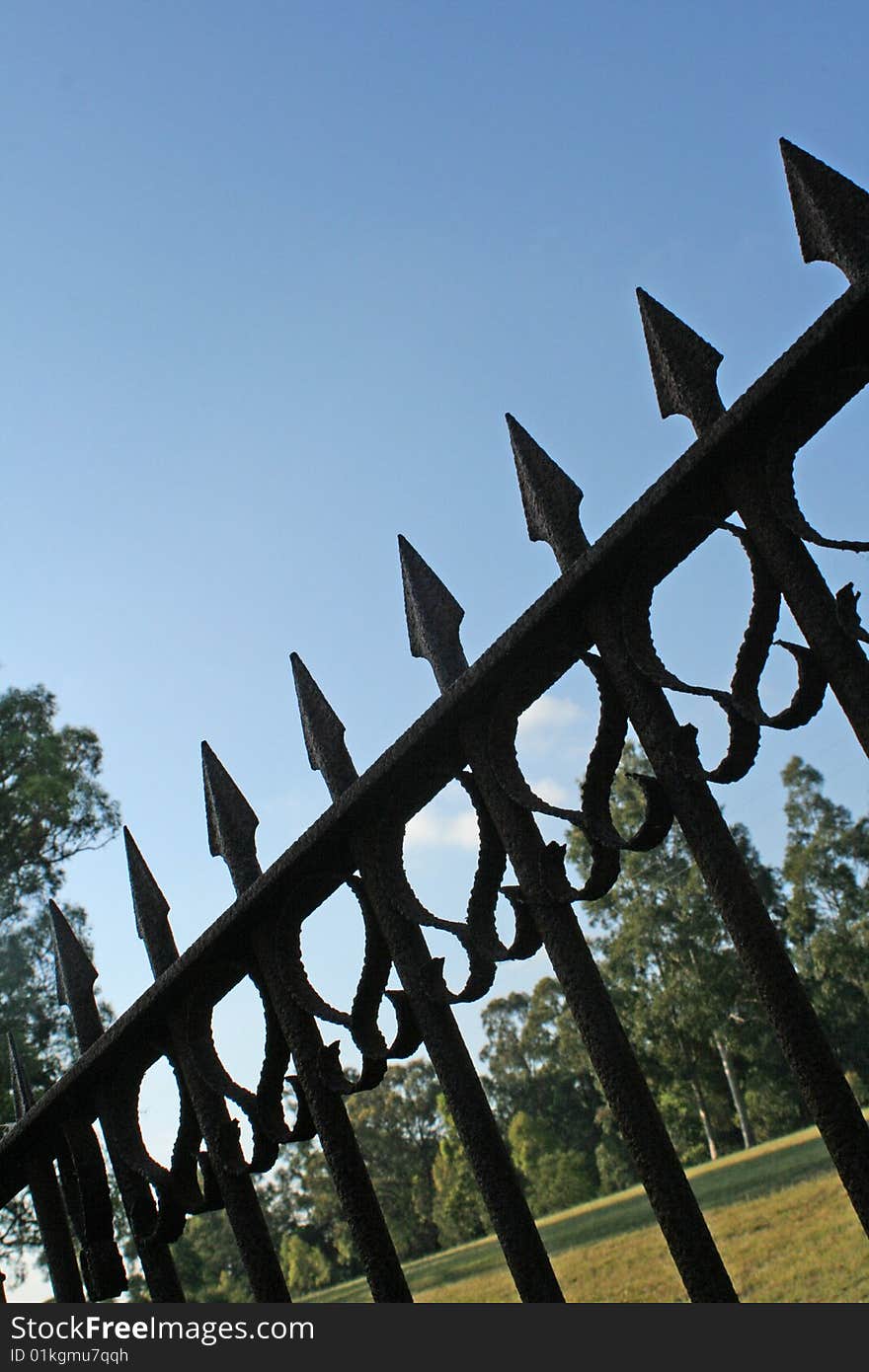 Rusty old fence gate in farmyard. Rusty old fence gate in farmyard