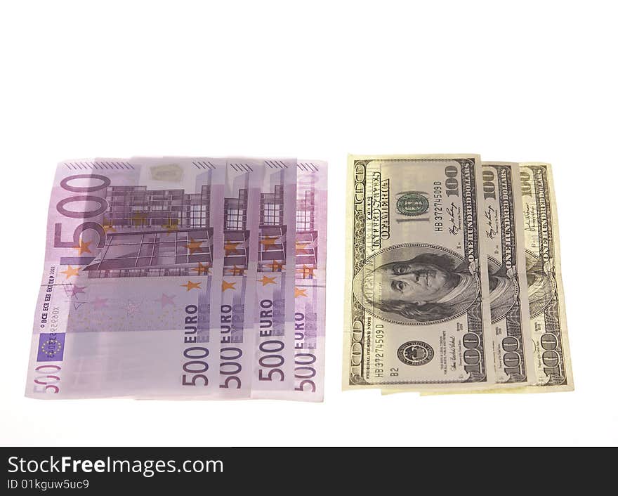 Few banknotes euros and dollars over white background. Few banknotes euros and dollars over white background