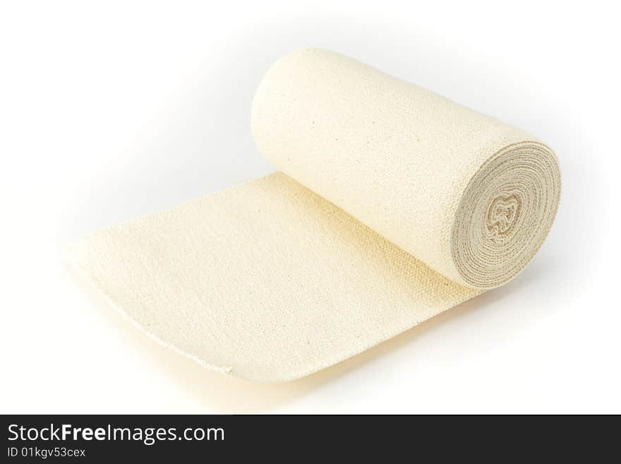 Bundled medical bandage on the bright background