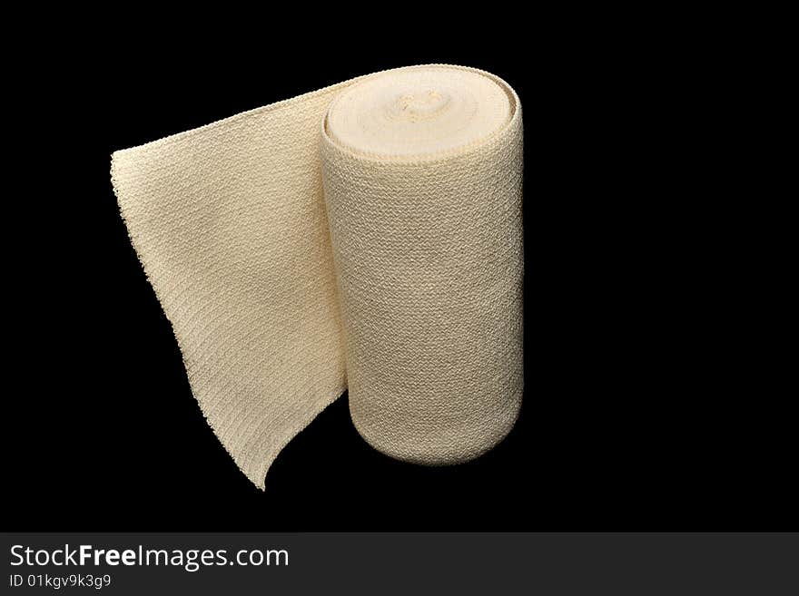 Rolled bandage on the black background