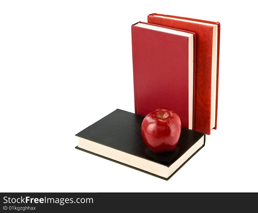 A red apple on  book