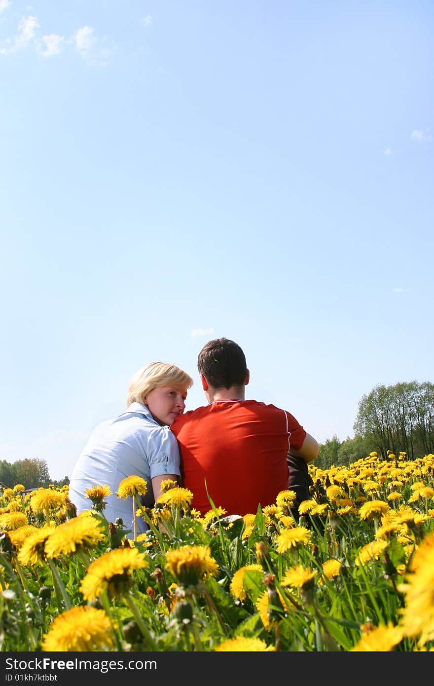 Happy young couple relaxing outdoors. Happy young couple relaxing outdoors