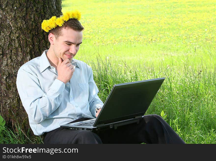 Young guy is working outdoors. Young guy is working outdoors