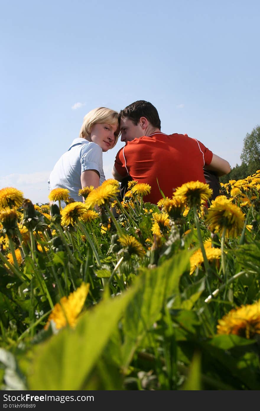 Happy young couple relaxing outdoors. Happy young couple relaxing outdoors