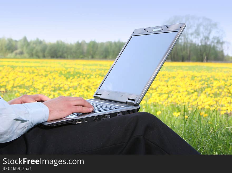 Young man with laptop outdoors. Young man with laptop outdoors