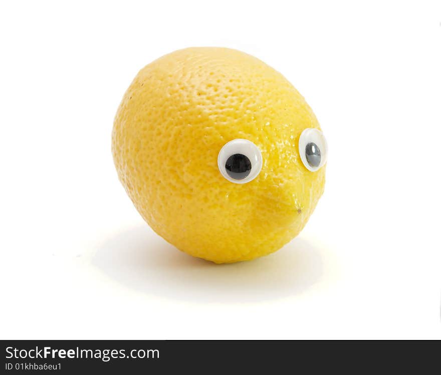 Funny lemon fruit with eyes on white background