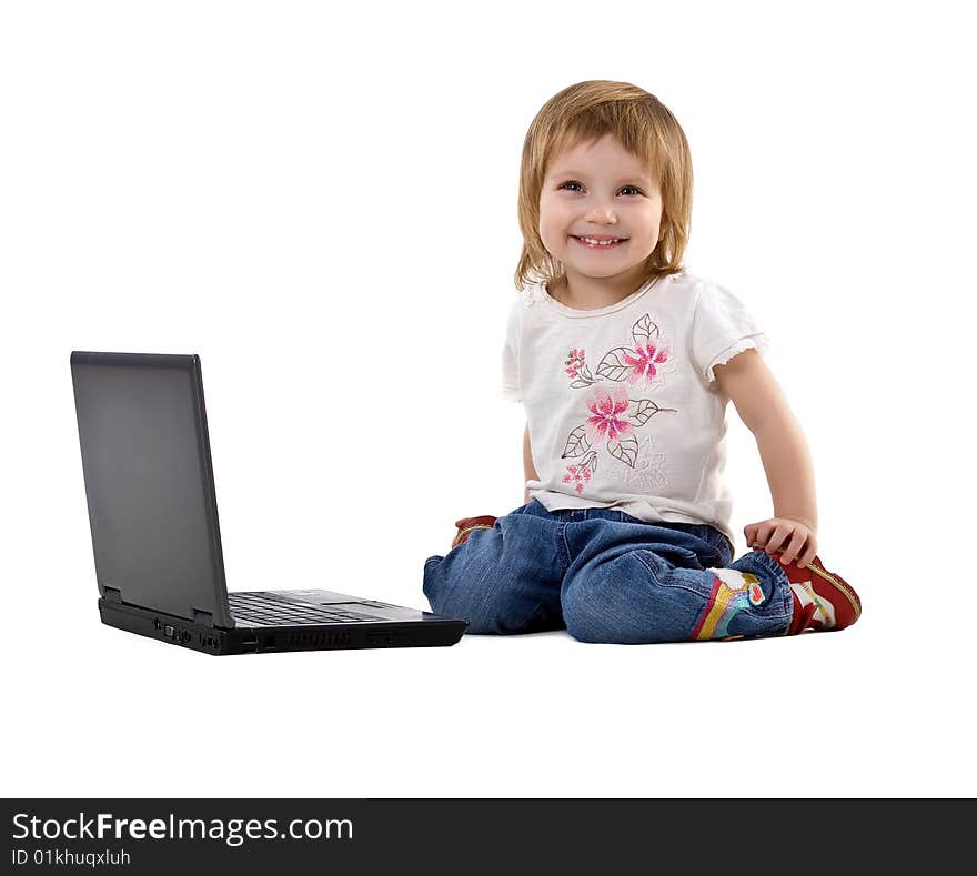 Little girl sit near laptop