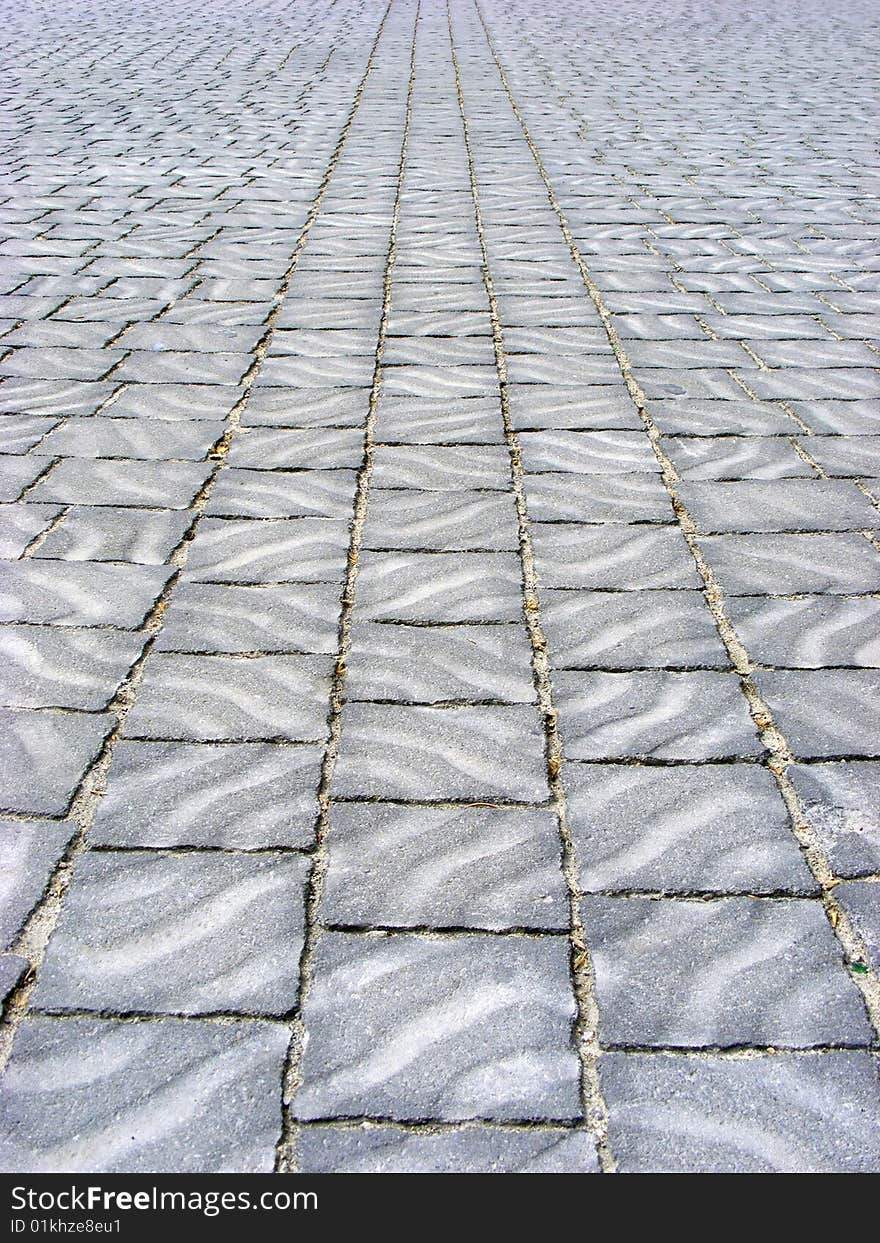 Area is covered with paving tiles with patterns