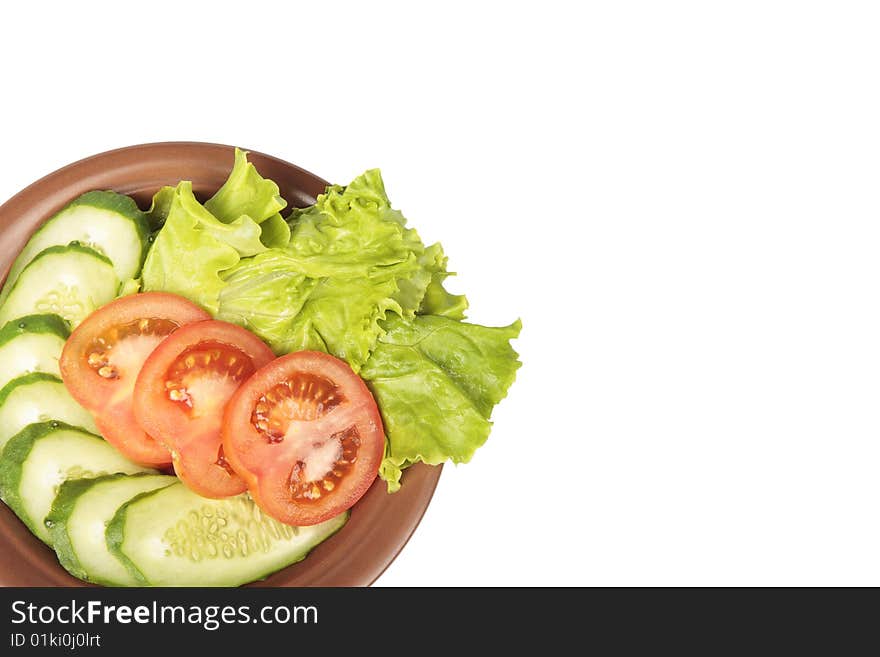 Vegetables on a plate on a white background