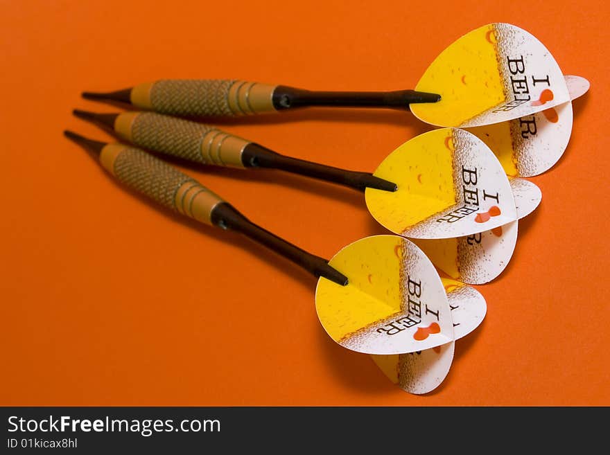 Three darts on red background