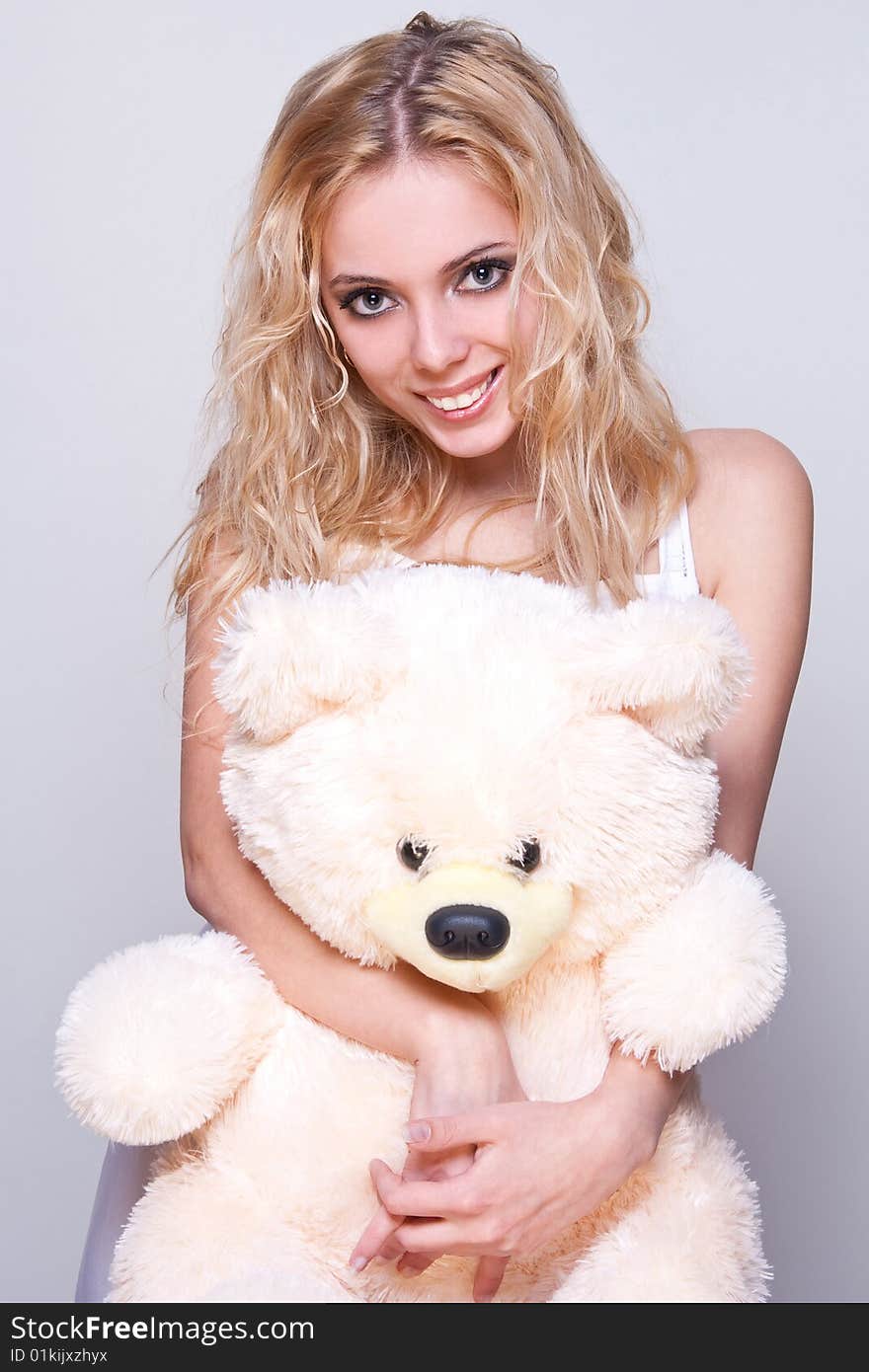 Beautiful girl with a teddy bear