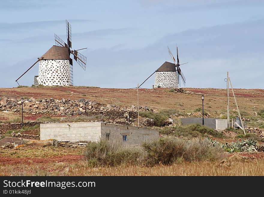 2 traditional windmills at Fuerteventura, Canary Islands. 2 traditional windmills at Fuerteventura, Canary Islands.