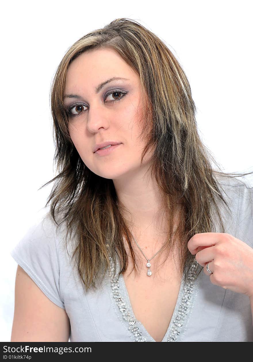 Studio Shot of a brunette woman with big brown eyes, isolated on white background. Studio Shot of a brunette woman with big brown eyes, isolated on white background