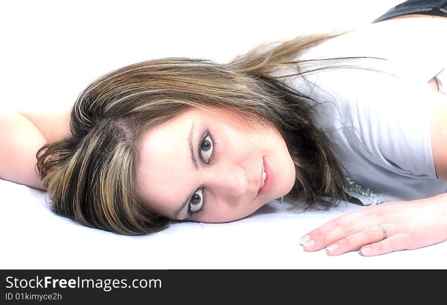 Studio Shot of a brunette woman with big brown eyes, isolated on white background. Studio Shot of a brunette woman with big brown eyes, isolated on white background