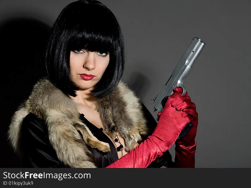 Retro brunette woman with gun