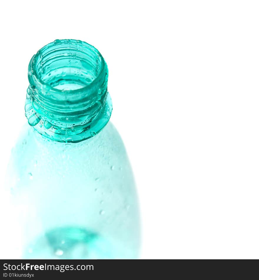 Bottle with water drops closeup on white background