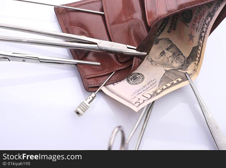 Surgical tools, purse and money. Surgical tools, purse and money