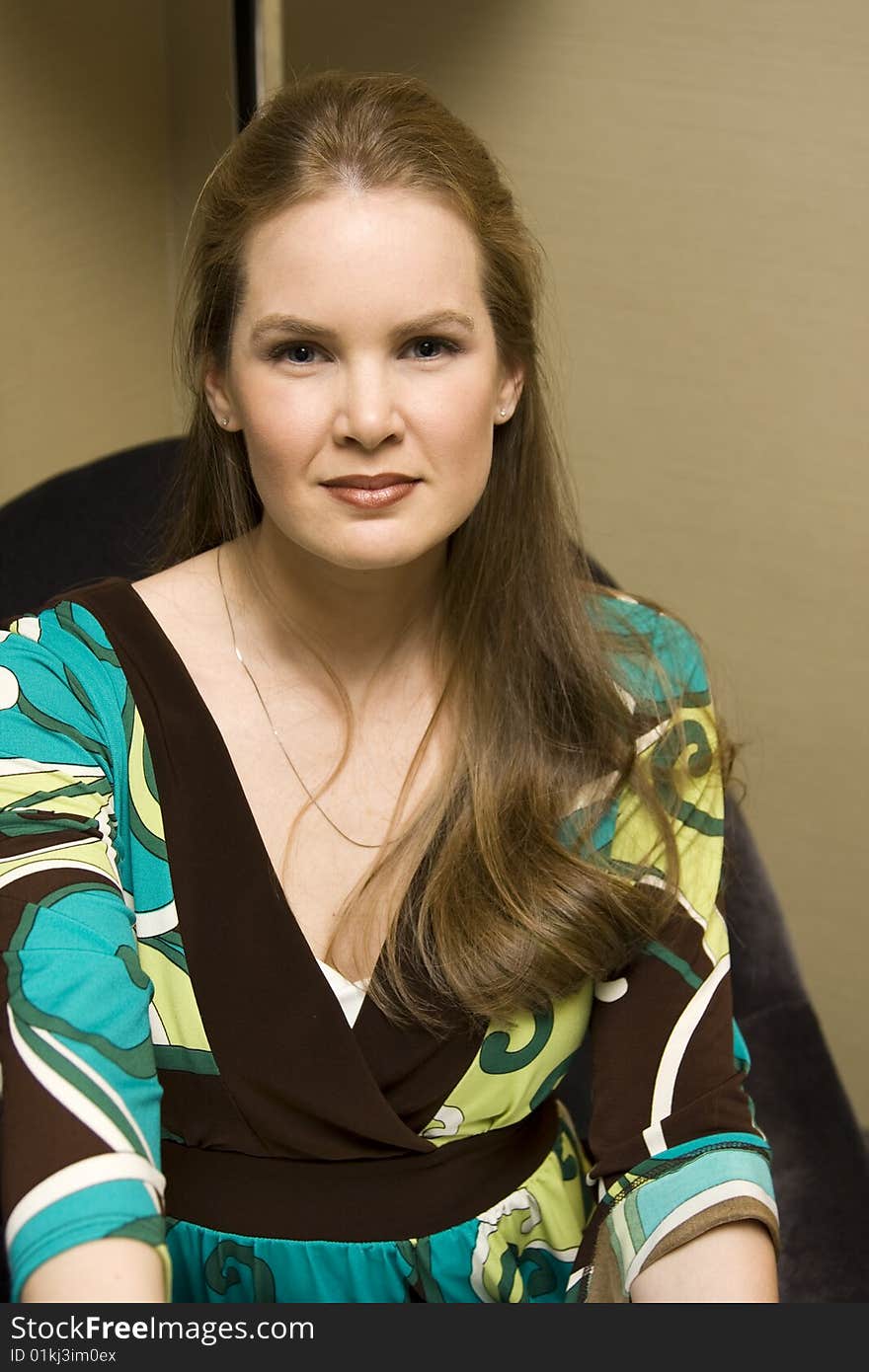 Young Attractive Female Smiling on Chair