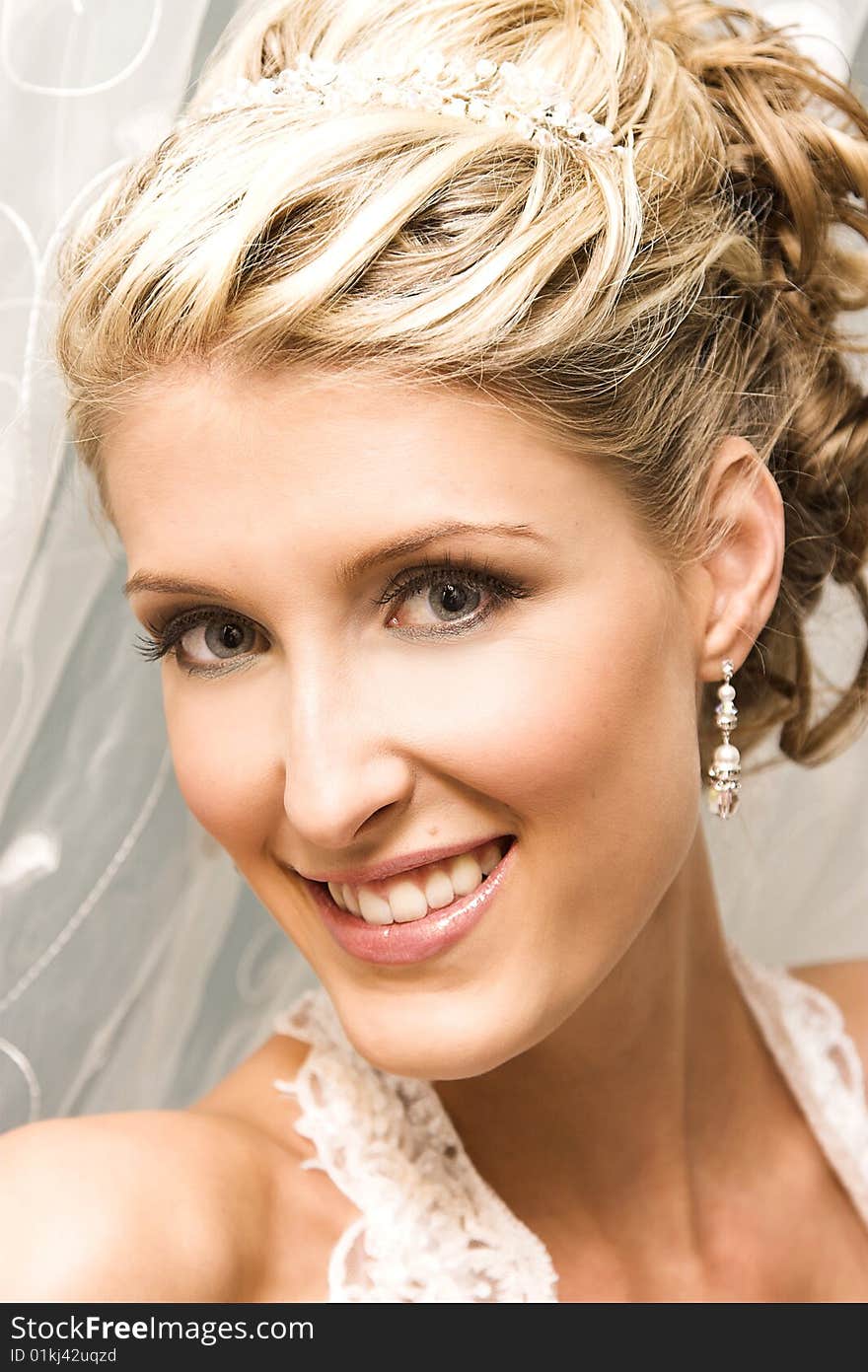 Beautiful Blond bride wearing diamond jewelery and tiara. Beautiful Blond bride wearing diamond jewelery and tiara