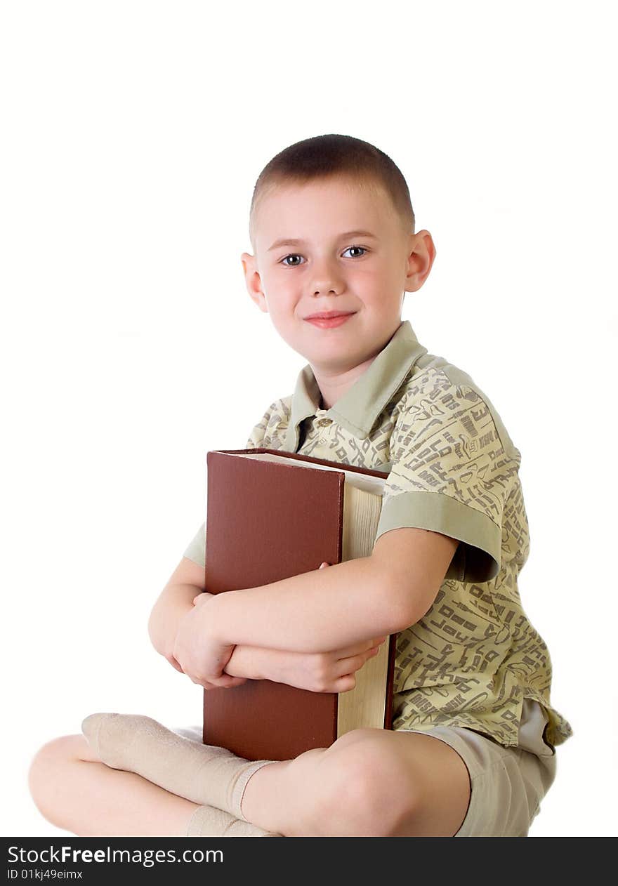 The child with book on the white