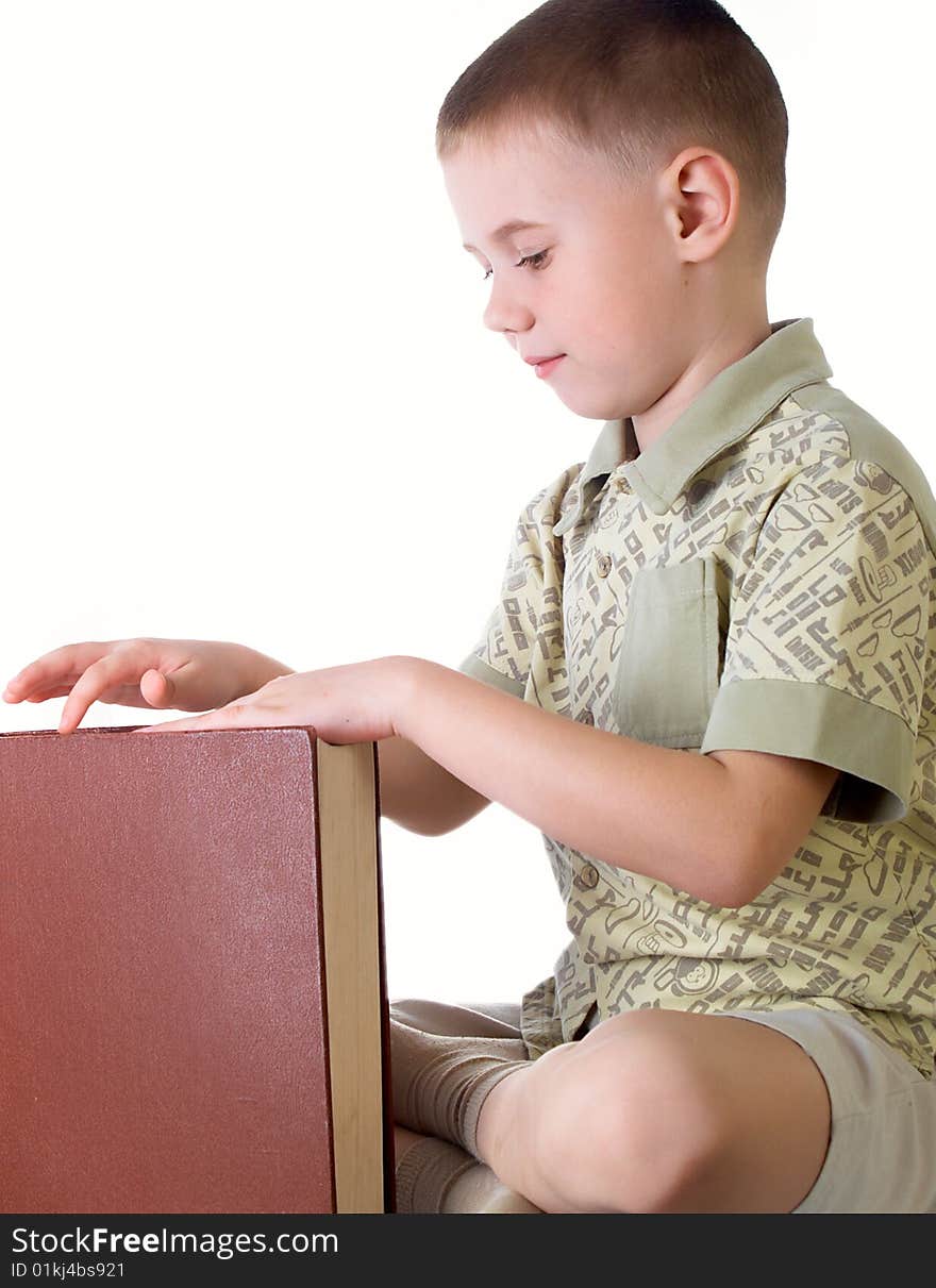 The child with book on the white