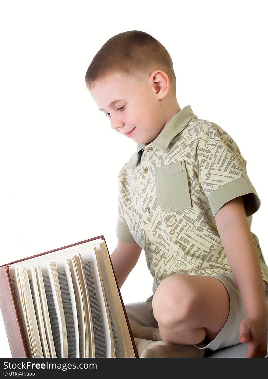 The child with book on the white