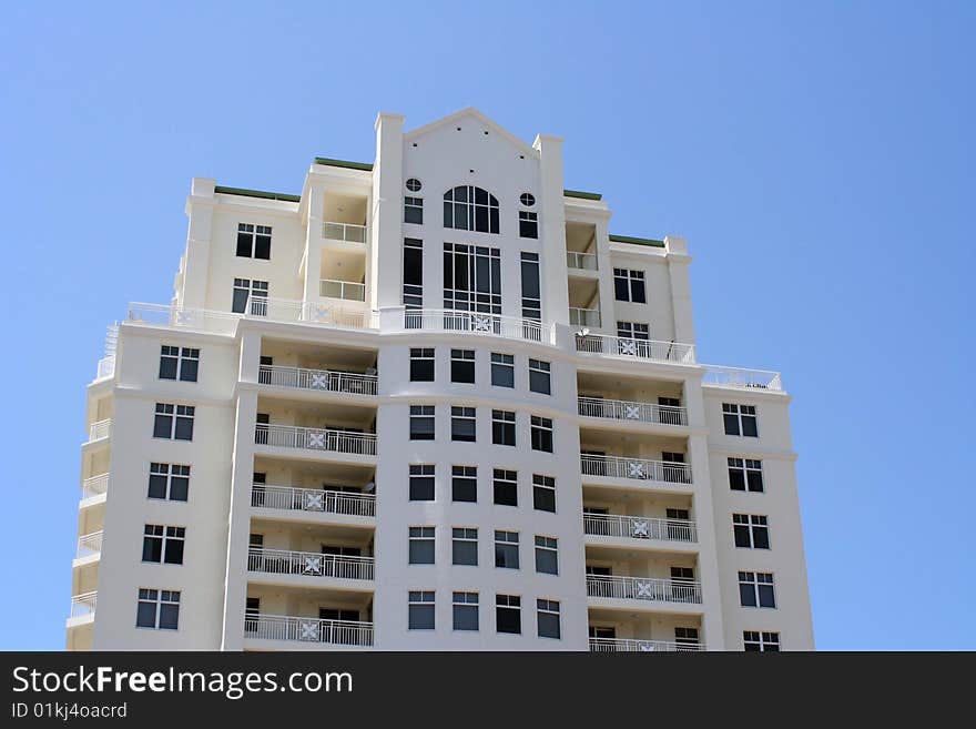 Image of a tall skyscraper with a blue sky background