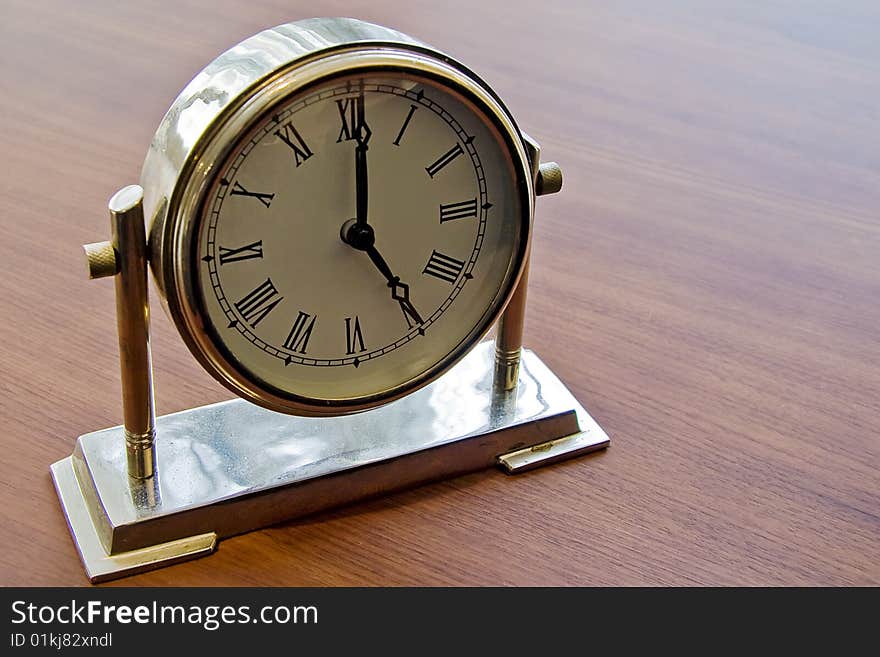 Vintage retro table clock on a rotary stand. Vintage retro table clock on a rotary stand