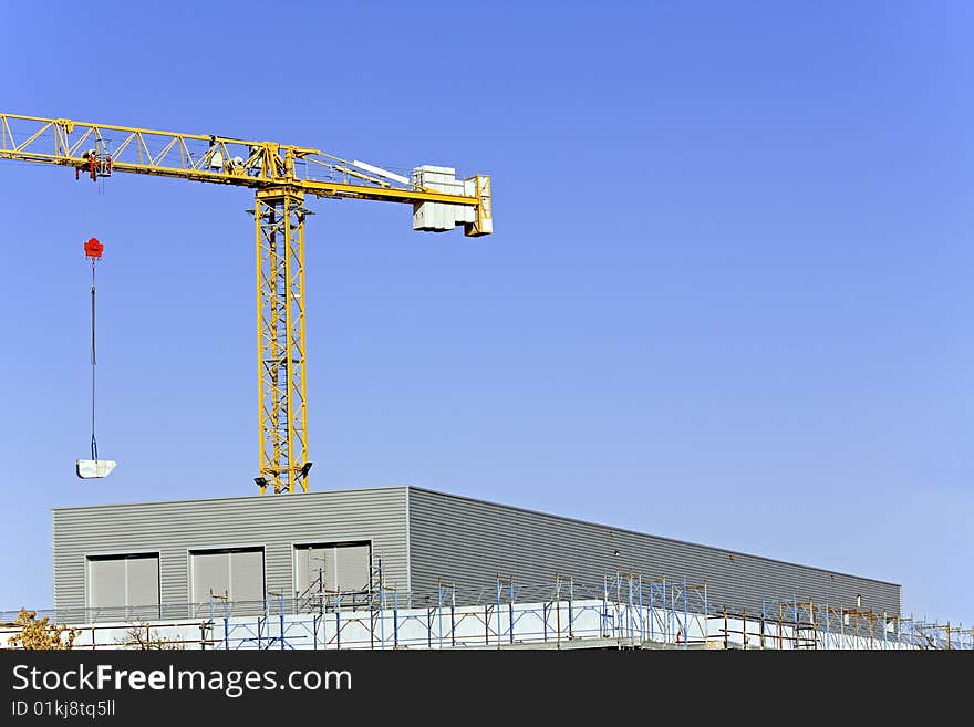 Scaffolds for the construction and crane. Scaffolds for the construction and crane