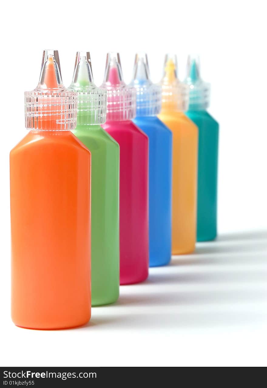 Row of color paint on a white background