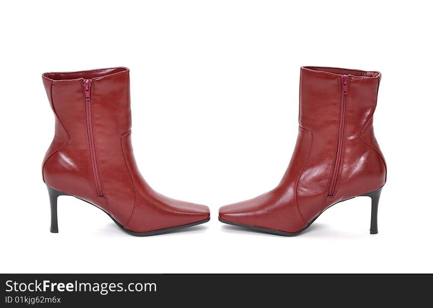 Red boots pointing at each other on a white background. Red boots pointing at each other on a white background