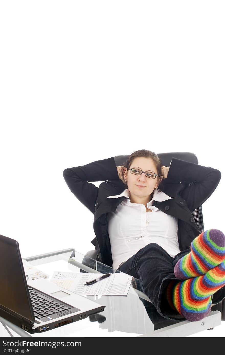 A young woman relaxing in her office, isolated on white. A young woman relaxing in her office, isolated on white