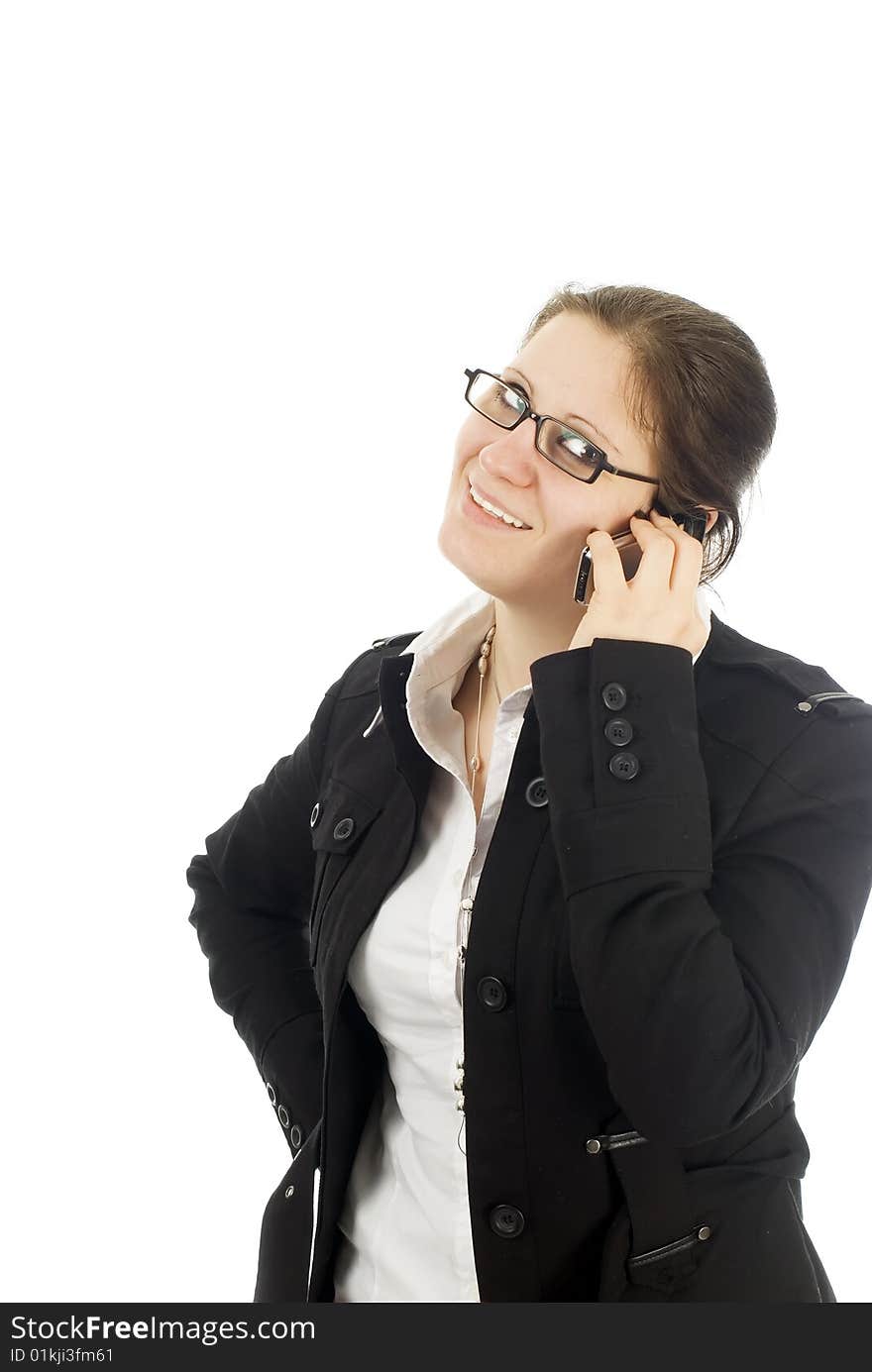 A young b usinesswoman talking on her cellphone, isolated on white. A young b usinesswoman talking on her cellphone, isolated on white