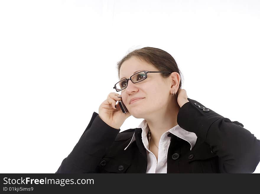 A young business woman talking on her cellphone. A young business woman talking on her cellphone