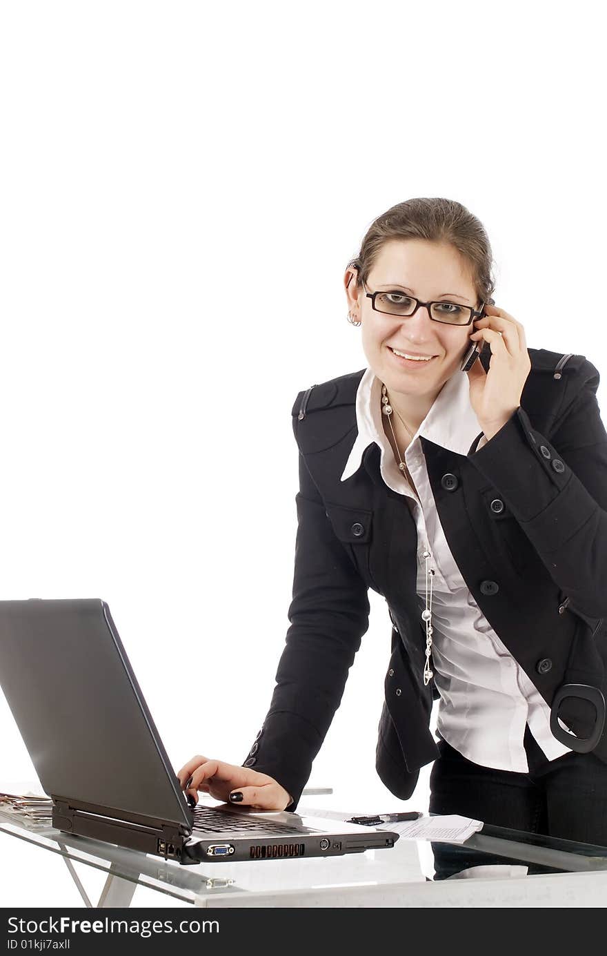 A young business woman working in her office, isolated on white. A young business woman working in her office, isolated on white