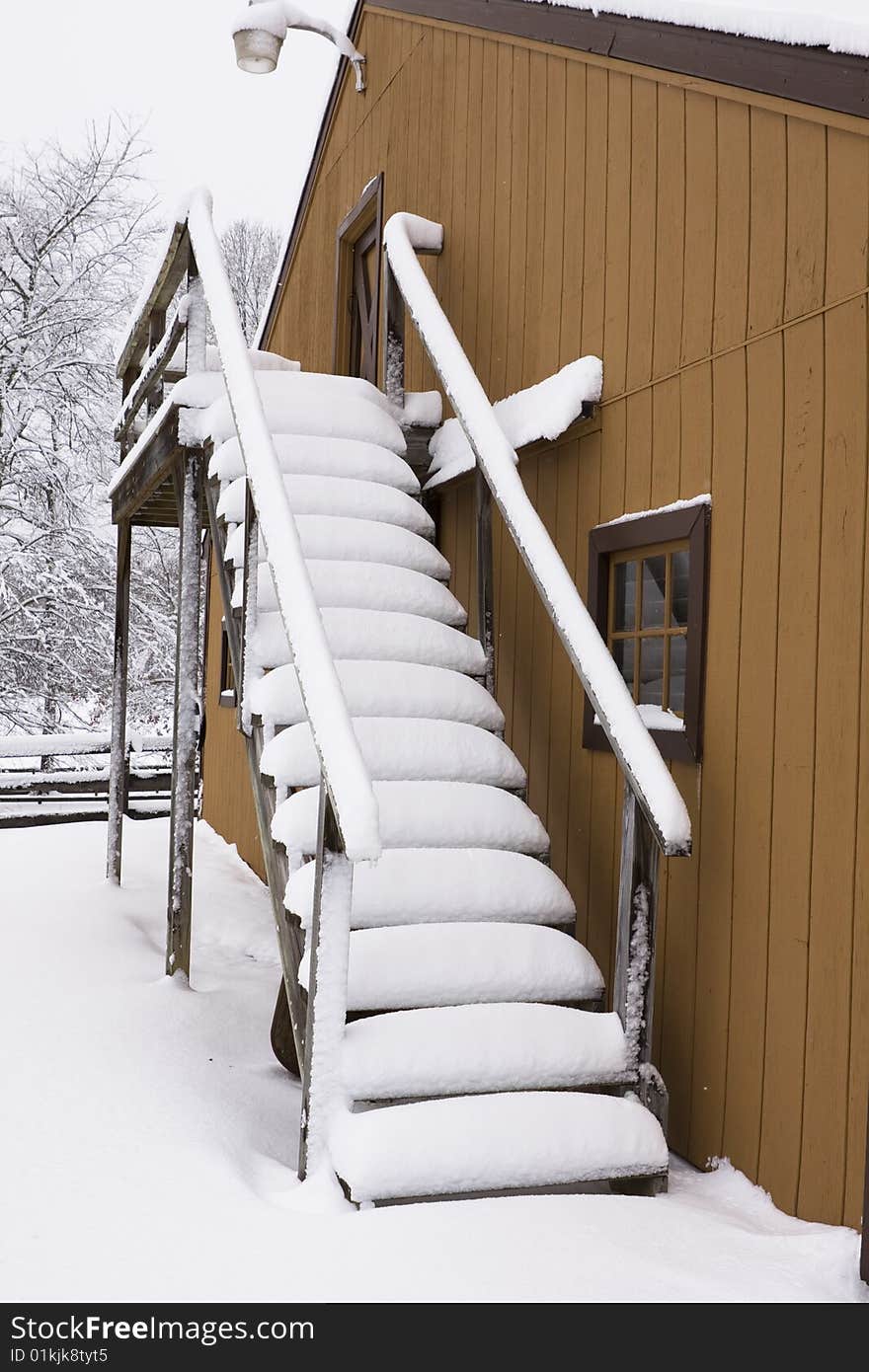 Stairs of a barn covered deep in snow. Stairs of a barn covered deep in snow.