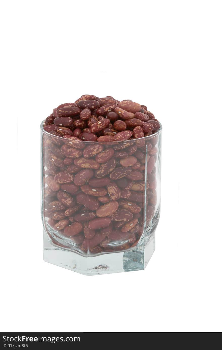 Haricot beans in the transparent glass isolated over white