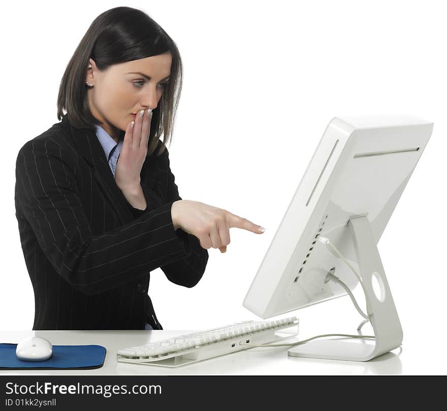 Beautiful businesswoman in her office indicating something on laptop