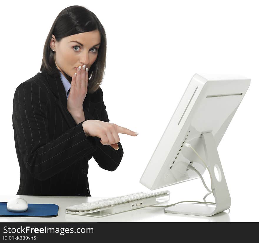 Beautiful businesswoman in her office indicating something on laptop